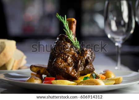 Gourmet Restaurant Dinner Meat and potatoes Royalty-Free Stock Photo #606914312