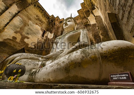 Giant statue of Buddha in Wat Si Chum At Sukhothai historical Park, Thailand