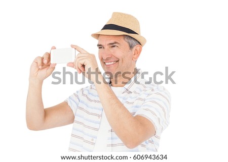 Handsome man taking picture on white background