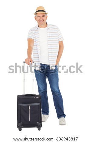 Handsome man posing with baggage on white background