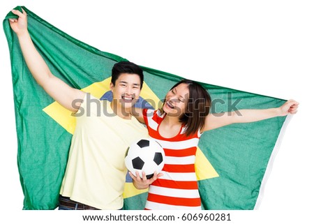 Couple holding brazil flag on white background