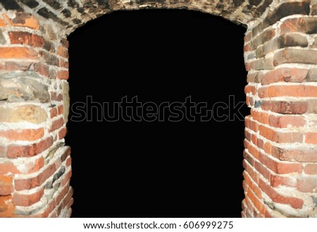 Old soft blur brick gothic arc entrance into darkness, can be used as frame for your text