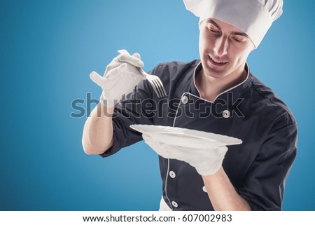 Chef with spoon on a blue background. Modern chef concept.
