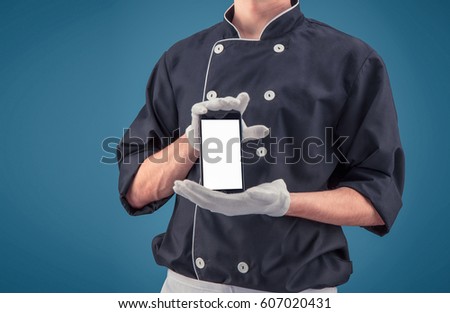 Chef with phone on a blue background in HD quality