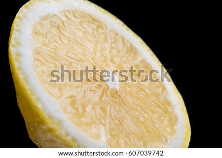 sliced lemon on a black background