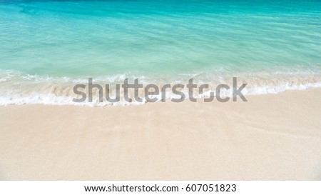 Beautiful marine view on Caribbean sea coast line with clean wavy surf ocean water on sandy beach in st. john, Antigua at sunny day as natural background