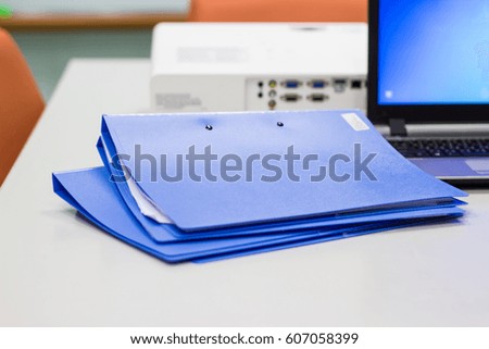 file folder with documents, Notebook, Projector   background  on white table