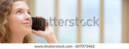 Happy girl using a smart phone, nice blue and green background