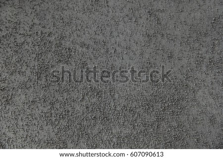 Background of building finishing cement with sand of gray color, horizontal image.