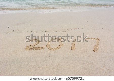 Numbers of 2017 written on the sand beach near Heritage folk village in Abu Dhabi, United Arab Emirates.