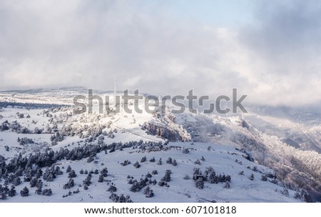 Snowy landscape. Winter landscape on a mountain top. Trees in the snow. mountain peak, blue sky, nature, winter sun. Mountain Ai-Petri. Crimea