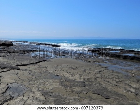 Pomos, Cyprus. A beautiful long Lava Sand beach on a quieter part of the island. Pools of clear Mediterranean water at low tide   Deserted for most of the year. Ideal for strollers and photography. 
