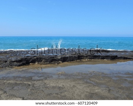 Pomos, Cyprus. A beautiful long Lava Sand beach on a quieter part of the island. Pools of clear Mediterranean water at low tide   Deserted for most of the year. Ideal for strollers and photography. 