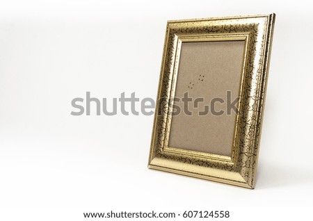 Gold photo frame isolated on white.