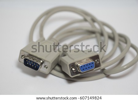 Serial communications connector RS 232. Isolated on white background. Blurry background. Royalty-Free Stock Photo #607149824