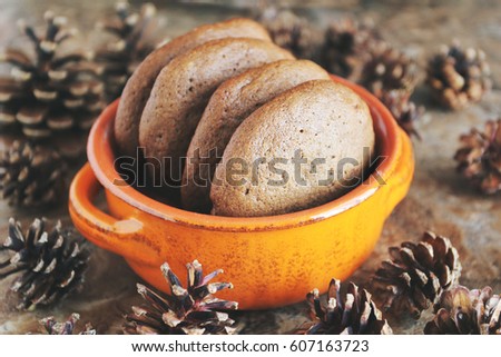 Homemade chocolate cookies for snack. Chocolate chip cookies shot in ceramic jar, closeup