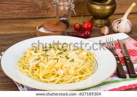 Spaghetti with creamy gravy. Studio Photo