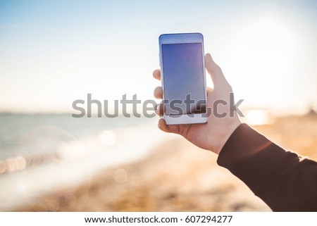Hand holding phone close-up