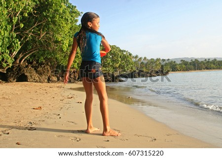 girl play on beach of sand 
