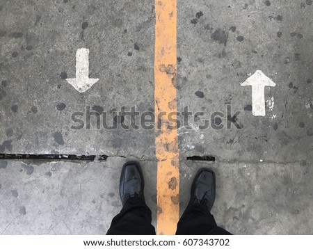 The man at the walkway is choosing way to walk