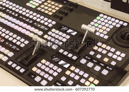 Video switcher of Television Broadcast with blurry background, working with video and audio mixer, control broadcasts in recording studio