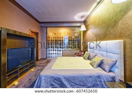 Russia, Moscow - modern designer renovation in a luxury building. Stylish bedroom interior with double bed