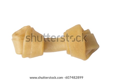 Artificial a bone for a dog with vitamins on white background Royalty-Free Stock Photo #607482899