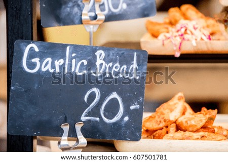 black board price tag in the street food market