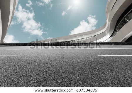 Asphalt road and modern building landscape