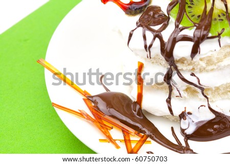 cake with whipped cream and caramel heart lying on a green cloth