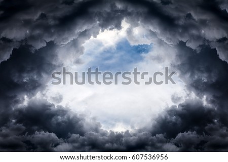 Hole of the Sky in the Dark Storm Clouds Royalty-Free Stock Photo #607536956