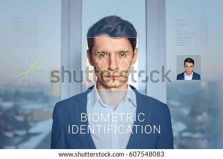 Recognition of a male face by layering a mesh and the calculation of the personal data by the software. Biometric verification and identification