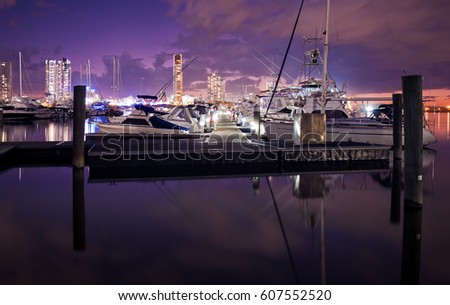 Landscape View Of A Pier With Luxury Boats And Yachts Reflecting In The Canal And Overlooking Southport During A Colourful Sunset, Main Beach, Gold Coast, Queensland, Australia