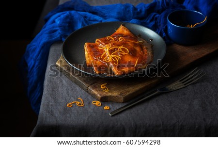 Crepe suzette in a rustic style and low key Royalty-Free Stock Photo #607594298