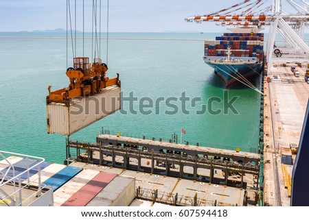 Container loading on vessel by crane at Port terminal, Laem Chabang Thailand Royalty-Free Stock Photo #607594418