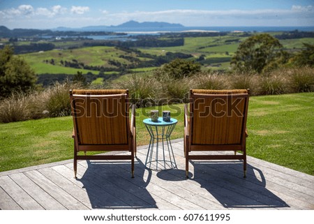 Armchairs facing landscape, New Zealand
