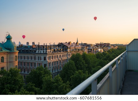 Stockholm sunset penthouse balcony with hot air balloons