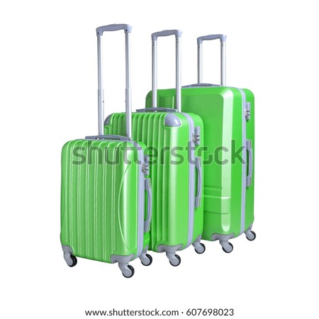 Three suitcases isolated on white background. Polycarbonate suitcases isolated on white. Green suitcases.