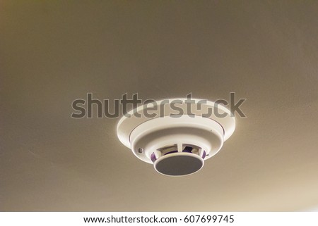 Close up white smoke detector on the ceiling