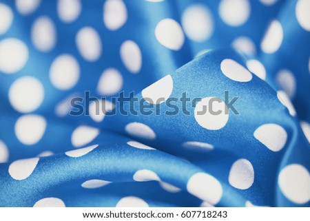 Fabric with polka dots texture background. Top view of cloth textile surface. 
