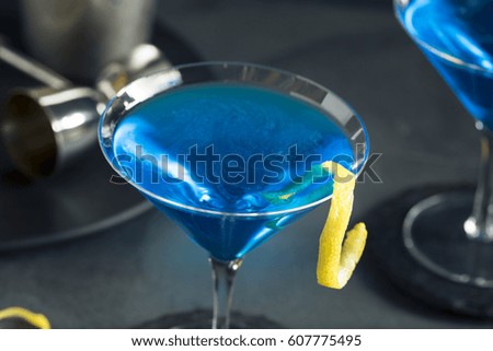 Refreshing Blue Martini Cocktail with Lemon Garnish