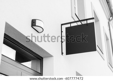 Black and white picture of empty outdoor business signage mockup to add company logo