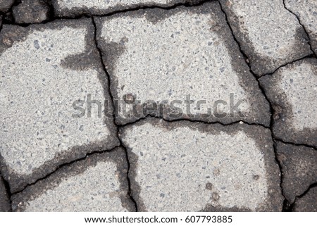 
Cracked road surface.