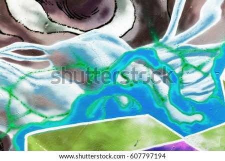 Art under ground. Beautiful street art graffiti style. The wall is decorated with abstract drawings house paint Modern iconic urban culture of street youth. Abstract stylish picture on wall street tag