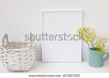 Frame mockup, wicker basket, pitcher with flowers on white background, styled image for product marketing, social media, blogging, feminine. Easter. Copy space for lettering artwork