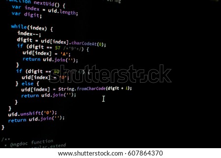 Coding software. While loop in software coded on black screen. Software developer with syntax in evidence.