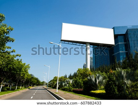 Blank billboard against blue sky.
