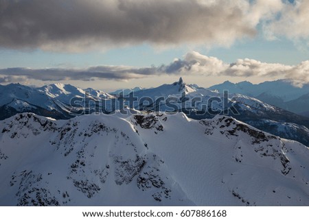 Whistler Mountain, BC, Canada, from an aerial perspective. Picture taken during a cloudy winter sunset.