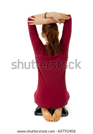 back of  sitting on feet  woman with raised arms