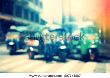Blurred  background abstract and can be illustration to article of threewheeler classic motorised tuk-tuk taxi in Bangkok, Thailand